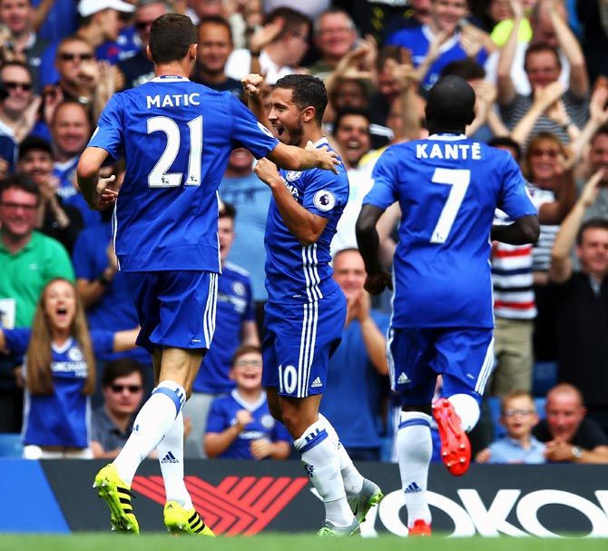 Eden Hazard, centre, celebrates with his team mates after scoring Chelsea's opening goal