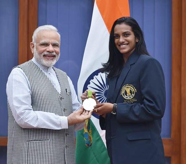 PV Sindhu with Prime Minister Narendra Modi after winning a silver medal at the 2016 Rio Olympics