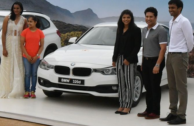 India's star Olympians PV Sindhu, Dipa Karmakar, and Sakshi Malik with Sachin Tendulkar and India's badminton coach P Gopichand at a function on Sunday, where they were gifted BMWs