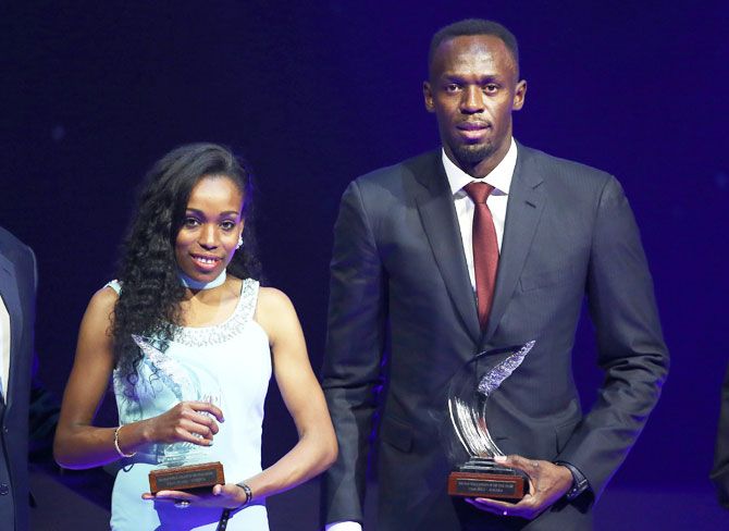 Usain Bolt of Jamaica (right) and Almaz Ayana of Ethiopia pose with their awards after being elected male and female World Athlete of the Year 2016 in Monaco, on Friday