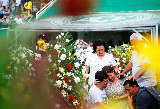 Relatives of players of Brazil's Chapecoense soccer team cry before a ceremony mourning the victims at Arena Conda stadium in Chapeco, Brazil, on Friday