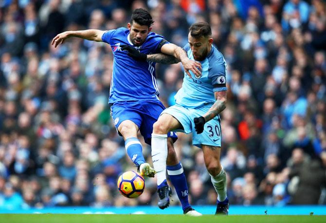 Chelsea's Diego Costa and Manchester City's Nicolas Otamendi compete for the ball