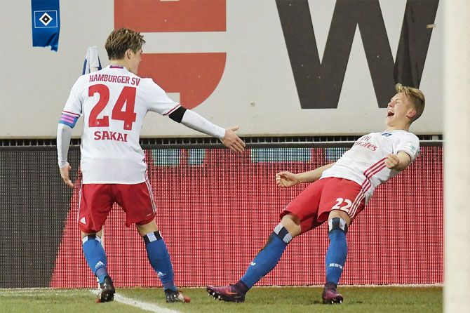 Hamburg players celebrate a goal against Darmstadt during their Bundesliga match on Sunday