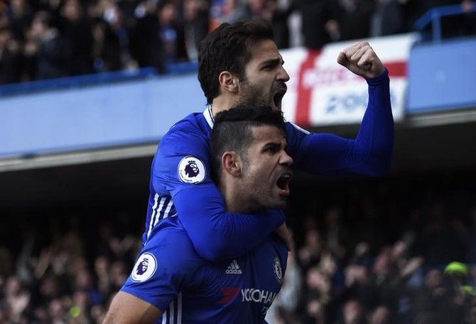 Chelsea's Diego Costa celebrates scoring their first goal with Cesc Fabregas
