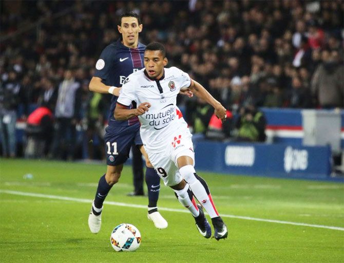 OGC Nice FC's Dalbert Henrique runs with the ball past PSG's Angel di Maria during their Ligue 1 match on Sunday