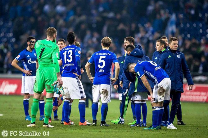 Players of Schalke 04 wear a dejected look after their Bundesliga match against Bayer Leverkusen on Sunday
