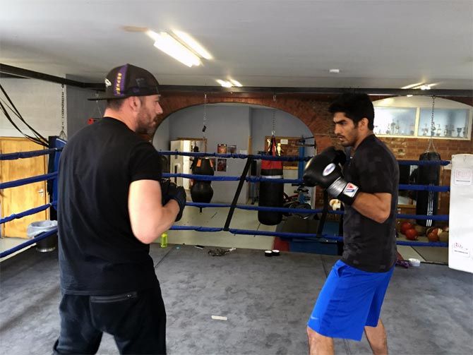 Vijender Singh spars with his trainer Lee Beard