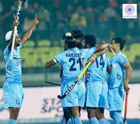 India Junior hockey team players celebrate a goal against Spain in Lucknow on Thursday