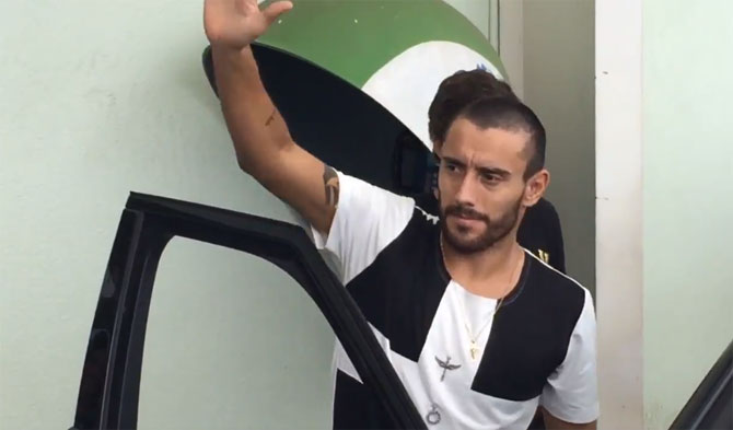 Alan Ruschel acknowledges the crowd as he leaves the hospital on Saturday