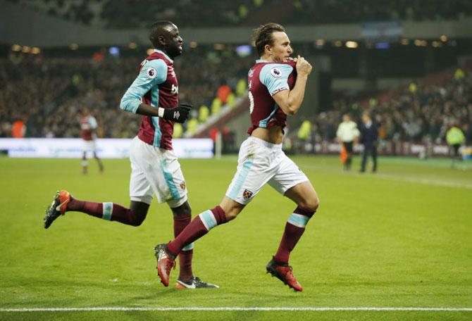 West Ham United's Mark Noble celebrates scoring against Hull City during their match at London Stadium