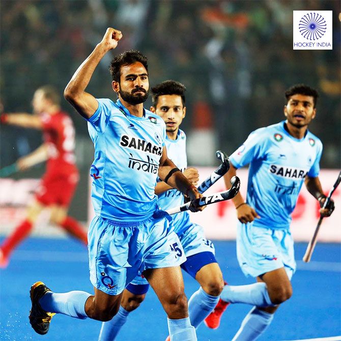India's Gurjant Singh celebrates on scoring the opening goal against Belgium