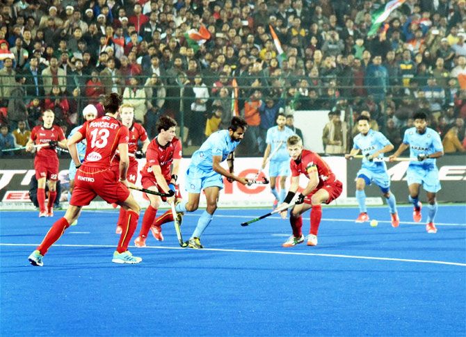 India and Belgium players vie for possession during the Jr World Cup Hockey final in Lucknow on Sunday