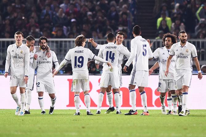 Real Madrid Cristiano Ronaldo celebrates scoring a goal with teammates during the FIFA Club World Cup final against Kashima Antlers at International Stadium Yokohama in Yokohama, Japan, on Sunday