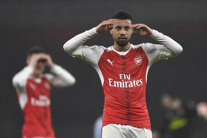 Arsenal's Francis Coquelin celebrates after the game against Stoke City at the Emirates Stadium in London on Sunday