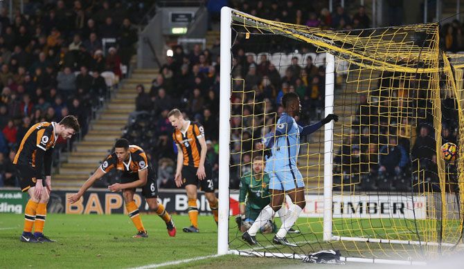 Hull City's Curtis Davies (2nd from left) reacts after scoring an own goal against Manchester City at KCOM Stadium in Hull