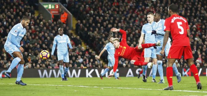 Liverpool's Alberto Moreno shoots at goal as he attempts to score against Stoke