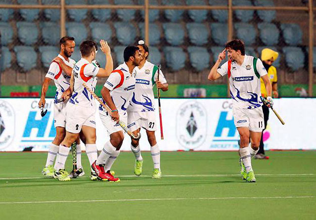 UP Wizards players celebrate their win over Delhi Waveriders in the Hockey India League 