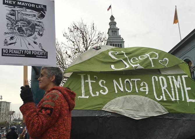 Demonstrators gather near Super Bowl City