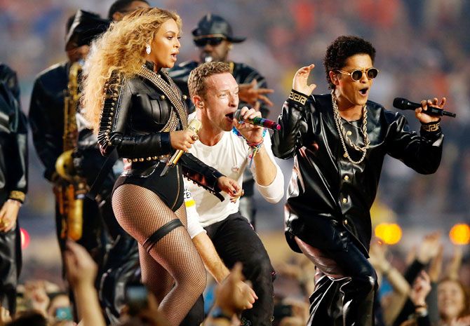  (Left-Right) Beyonce, Chris Martin of Coldplay and Bruno Mars perform their closing set