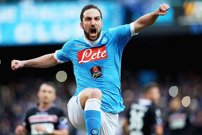 Napoli's Gonzalo Higuain celebrates the opening goal against Carpi FC during their Serie A match at Stadio San Paolo in Naples on Sunday