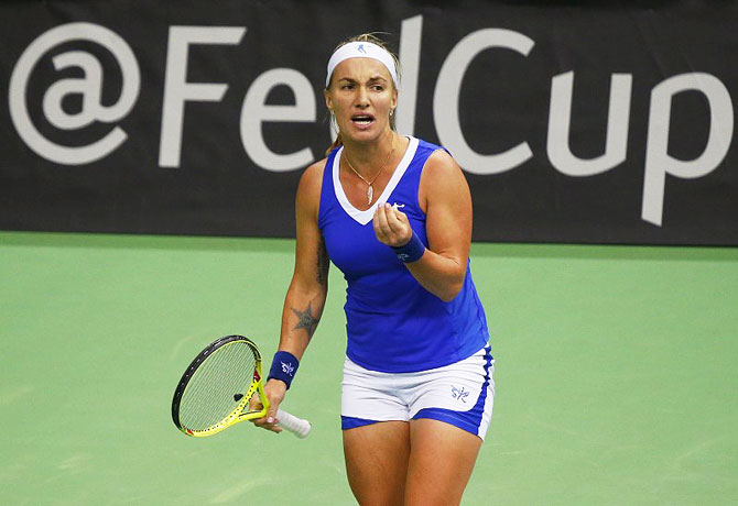 Russia's Svetlana Kuznetsova reacts after losing a point during her Fed Cup World Group match against Kiki Bertens of the Netherlands