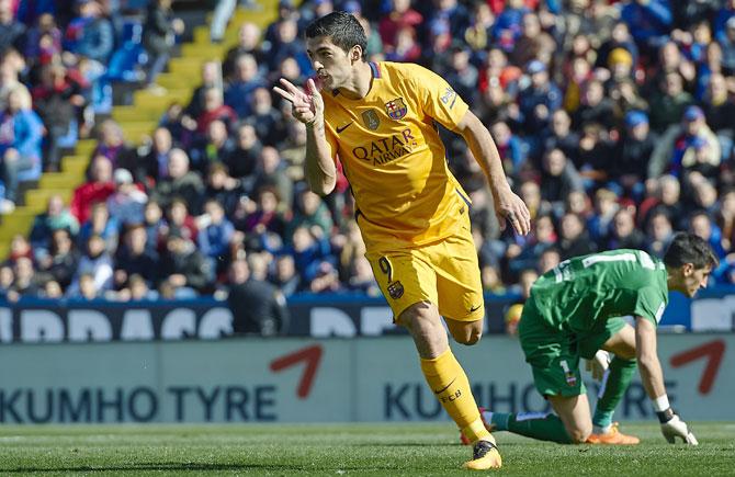 FC Barcelona's Luis Suarez celebrates scoring his team's second goal against Levante during their La Liga match at Ciutat de Valencia on Sunday