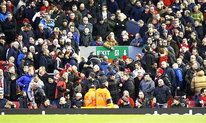 Liverpool fans leave the stadium in protest 