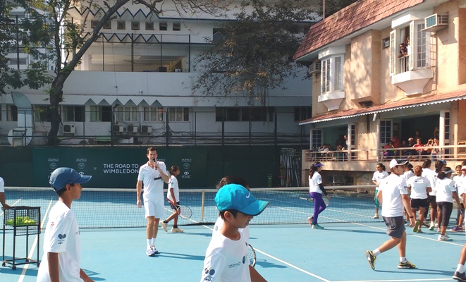 Britain's Tim Henman conducts a clinic for youngsters at the MSLTA courts in Mumbai 