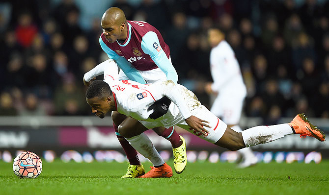 Liverpool's Divock Origi battles for the ball with West Ham United's Angelo Ogbonna Obinza