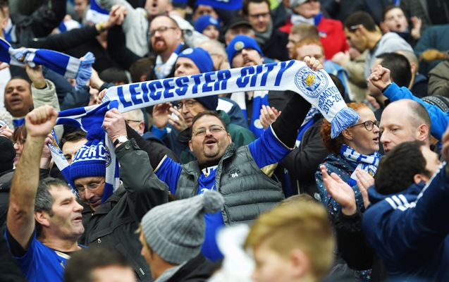 Leicester City supporters celebrate their team's win over Manchester City in the Premier League 