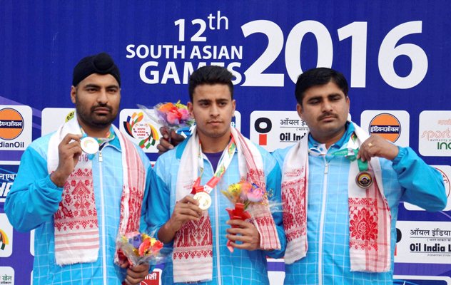 Gold medalist Neeraj Kumar, silver medalist Gurpeet Singh and bronze medalist Mahender Singh of India after winning the Men’s 25m Standard Pistol event 