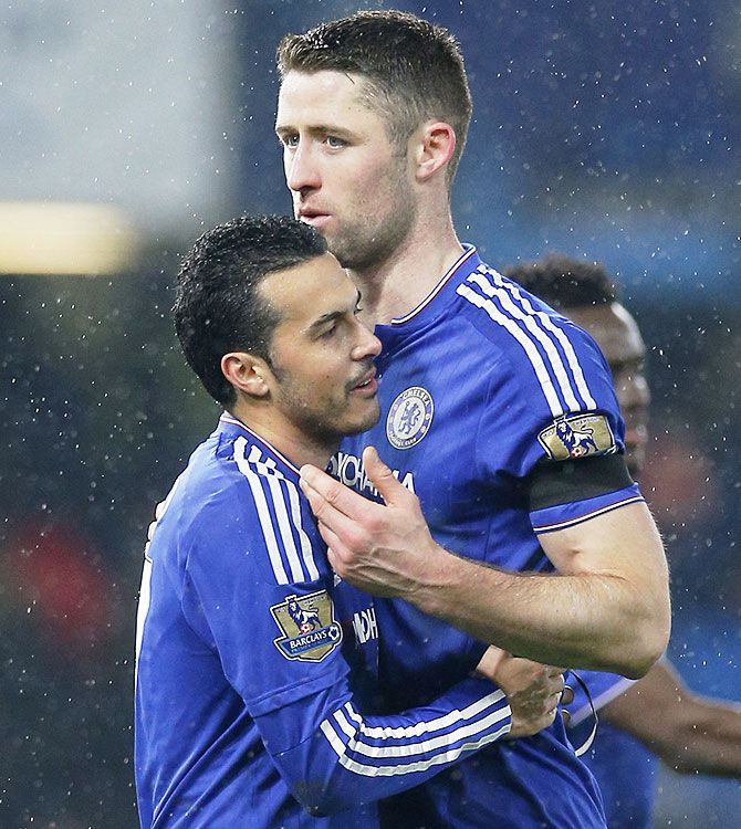 Chelsea's Pedro celebrates with teammate Gary Cahill