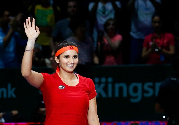 Sania Mirza of India wave to the crowd after a win at the WTA Finals in Singapore 