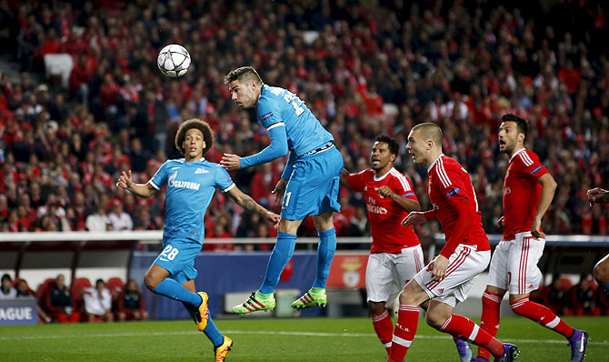 Zenit St. Petersburg's Javi Garcia (2nd from left) attempts a header on goal