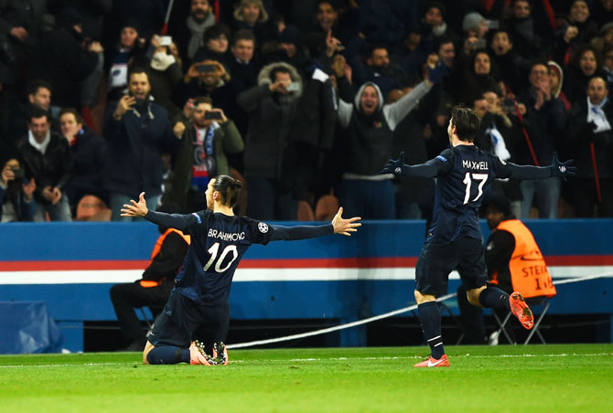 Paris Saint-Germain's Zlatan Ibrahimovic celebrates with Maxwell as he scores their first goal from a free-kick