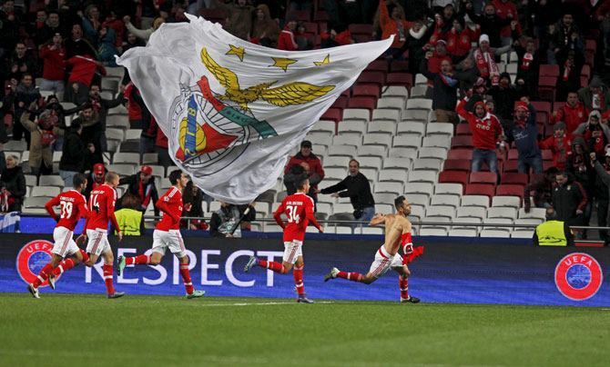 Benfica's Jonas (right) celebrates with teammates after scoring the winning goal against Zenit St. Petersburg during their UEFA Champions League, Round of 16, fist leg match at the Luz Stadium in Lisbon on Tuesday