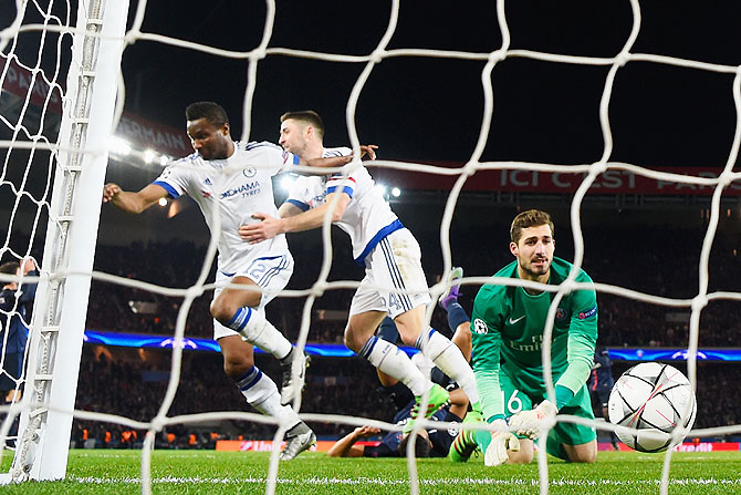 Chelsea's John Mikel Obi (left) celebrates with teammate Gary Cahill as he scores the equaliser past Paris Saint-Germain goalkeeper Kevin Trapp