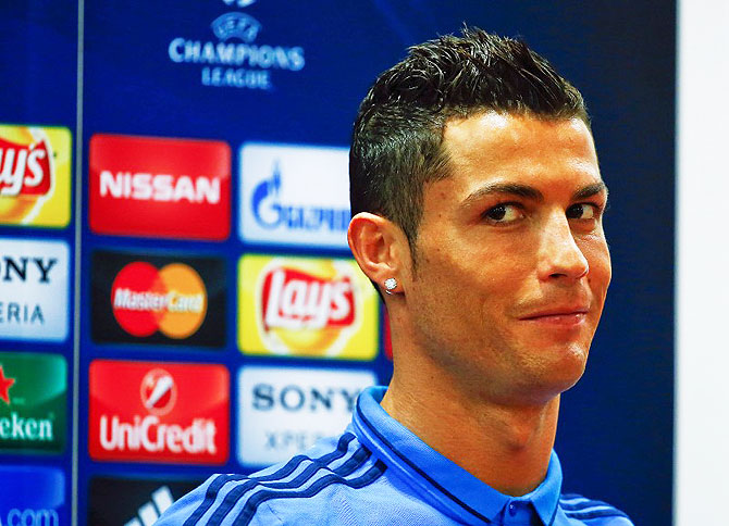 Real Madrid's Cristiano Ronaldo reacts during a news conference on Tuesday