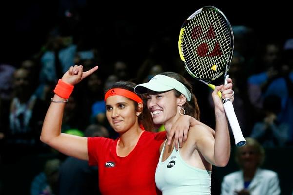 Sania Mirza of India and Martina Hingis of Switzerland celebrate winning a WTA tournament 