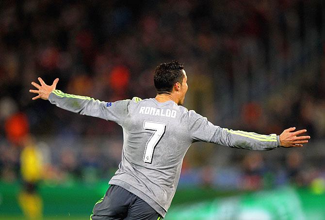 Real Madrid's celebrates after scoring the opening goal against AS Roma during the UEFA Champions League round of 16 first leg match at Stadio Olimpico in Rome on Wednesday