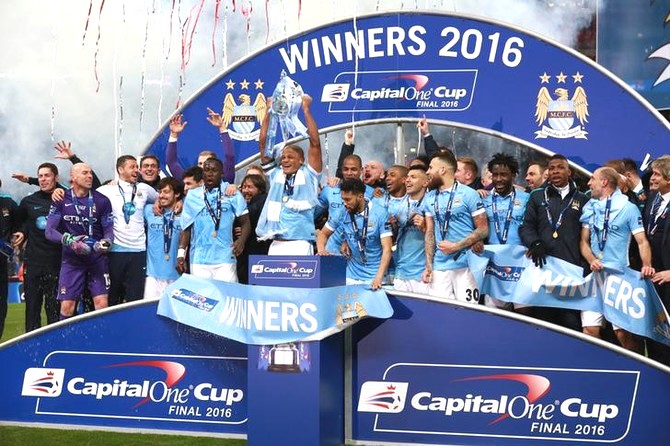 Manchester City celebrate winning the Capital One League Cup Final after beating Liverpool on penalties at the Wembley on Sunday