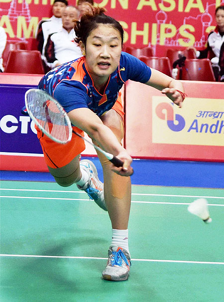 China's Sun Yu stretches to play a return against Japan's Sato Sayaka during the women's singles final of the Badminton Asia Team Championships in Hyderabad on Sunday