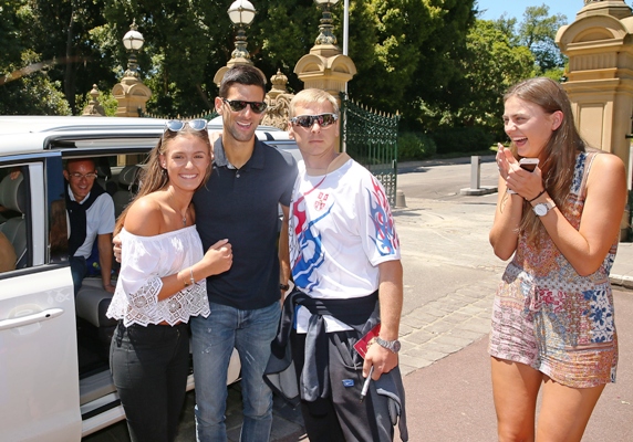 Novak Djokovic of Serbia poses with supporters 