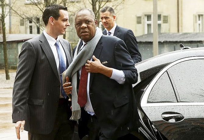 Acting FIFA president Issa Hayatou (centre) and acting secretary general Markus Kattner (right) arrive for the CONCACAF meeting in Zurich, Switzerland on Thursday