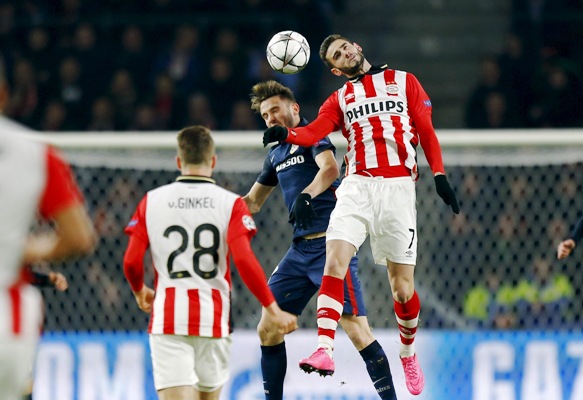 Atletico Madrid's Juanfran in action against PSV Eindhoven's Jurgen Locadia 