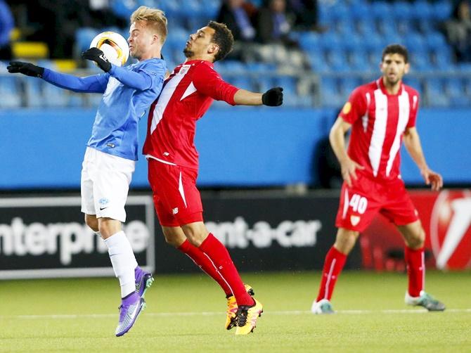 Molde's Sander Svendsen and Sevilla's Timothee Kolodziejczak 