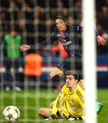 Chelsea’s goalkeeper Thibaut Courtois looks on in despair as Paris Saint-Germain’s Edinson Cavani scores the winning goal during their UEFA Champions League round of 16 first leg match at Parc des Princes in Paris on Tuesday