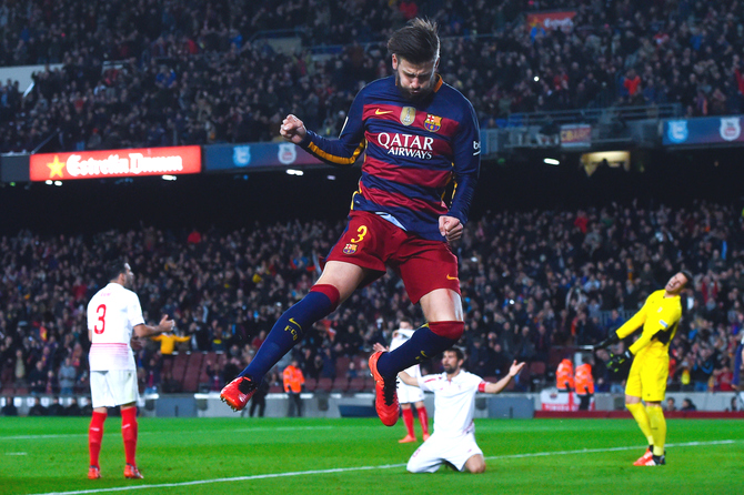 FC Barcelona's Gerard Pique celebrates after scoring his team's second goal against Sevilla dueing their La Liga match at Camp Nou in Barcelona on Sunday