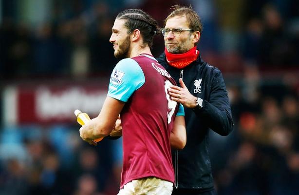 Jurgen Klopp, manager of Liverpool, congratulates Andy Carroll of West Ham United after their Premier League match