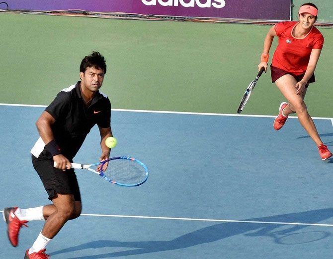 Tennis stars Sania Mirza and Leander Paes in action during a mixed doubles exhibition match in November